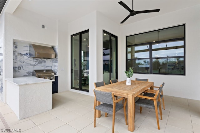 tiled dining area featuring ceiling fan and plenty of natural light