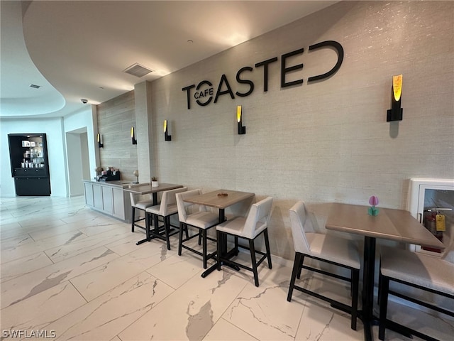 interior space featuring light tile flooring