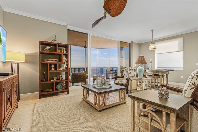 living room with crown molding, floor to ceiling windows, light tile floors, and a wealth of natural light