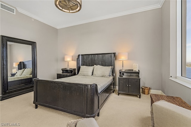 carpeted bedroom featuring crown molding