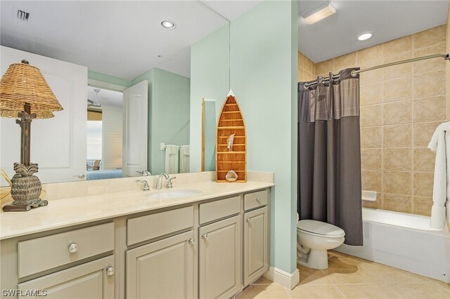 full bathroom featuring toilet, shower / bathtub combination with curtain, tile floors, and vanity