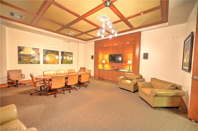 carpeted dining room with coffered ceiling