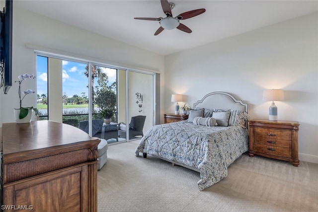 bedroom featuring light colored carpet, ceiling fan, and access to exterior