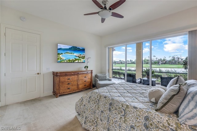 bedroom with ceiling fan, light carpet, and access to exterior