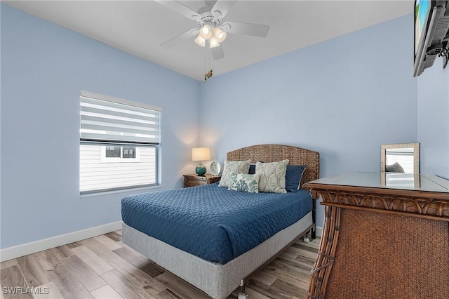 bedroom featuring ceiling fan and light hardwood / wood-style flooring