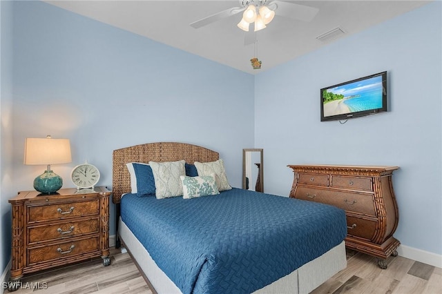 bedroom with light wood-type flooring and ceiling fan