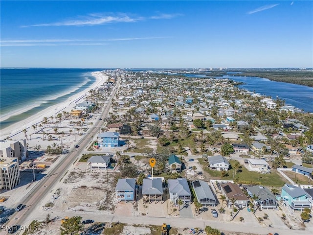 aerial view featuring a water view and a beach view