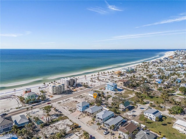 drone / aerial view with a water view and a view of the beach