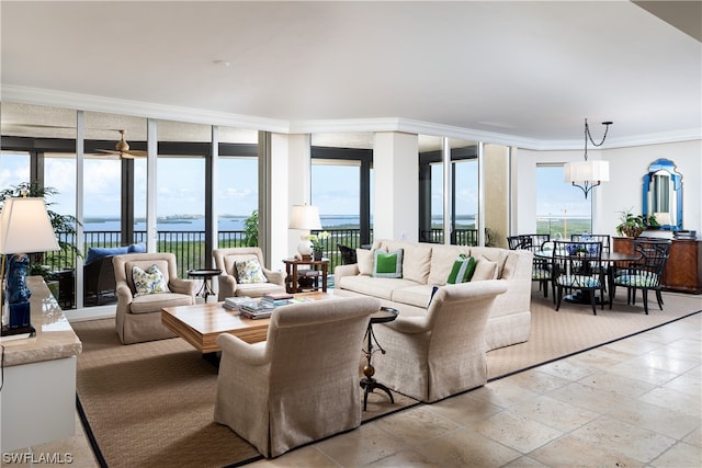 living room featuring a wall of windows, ornamental molding, and a water view