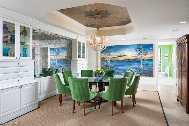 dining space featuring a raised ceiling, ornamental molding, light tile patterned floors, and a notable chandelier