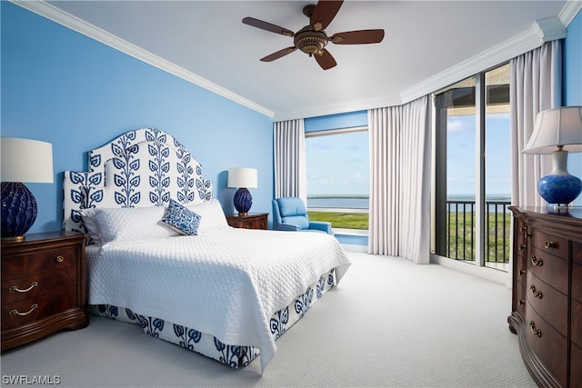 carpeted bedroom with a water view, ornamental molding, and multiple windows