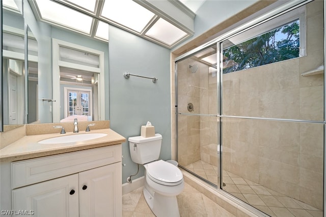 bathroom with french doors, toilet, a shower with door, tile floors, and vanity