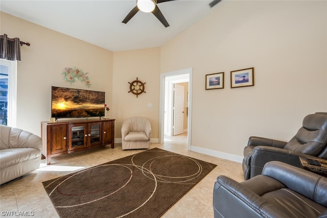 living room featuring light tile flooring and ceiling fan