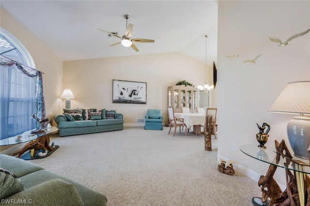 living room with carpet, vaulted ceiling, and ceiling fan with notable chandelier