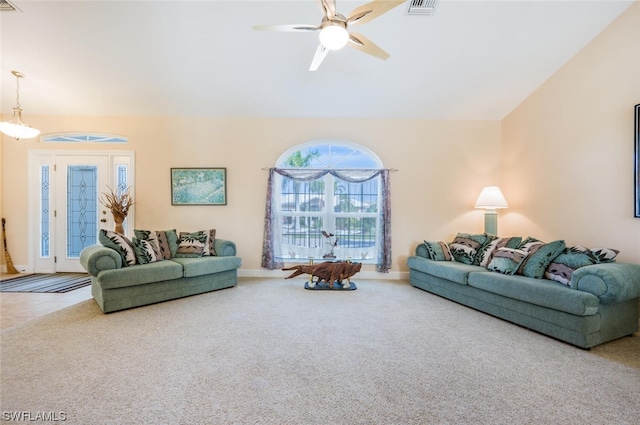 living room featuring light tile floors and ceiling fan