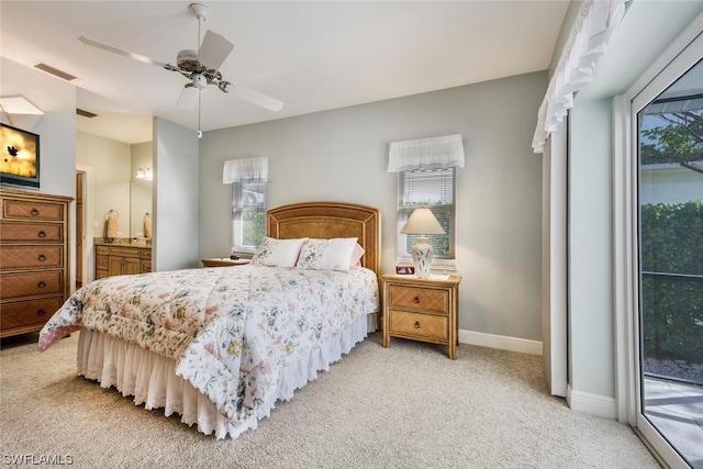 carpeted bedroom featuring access to exterior and ceiling fan