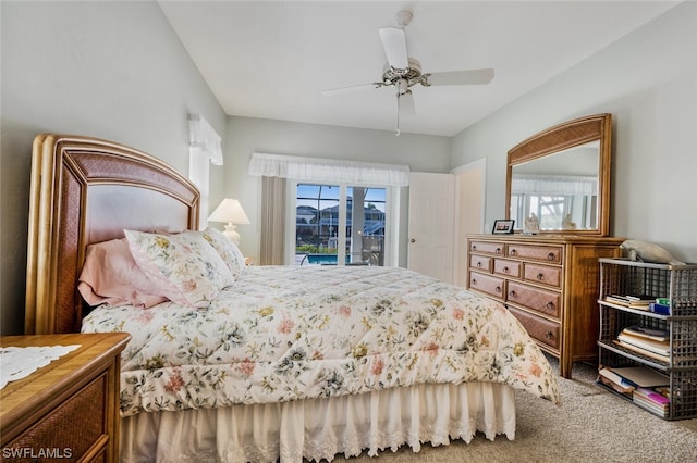 carpeted bedroom with ceiling fan and access to outside