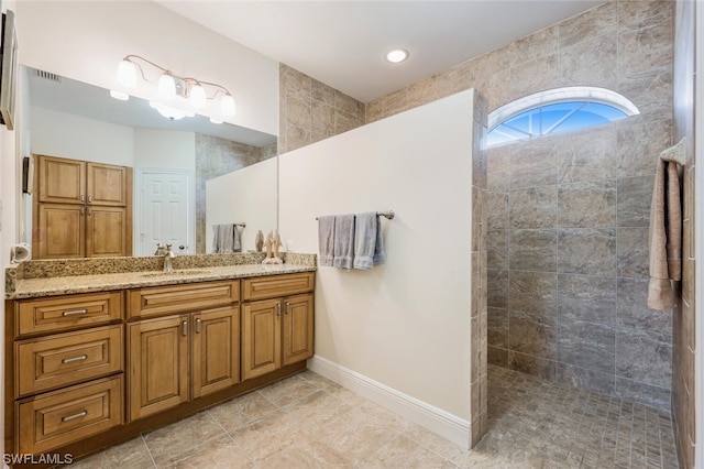 bathroom with tile floors and vanity