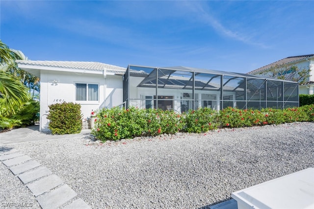 view of front of house with glass enclosure