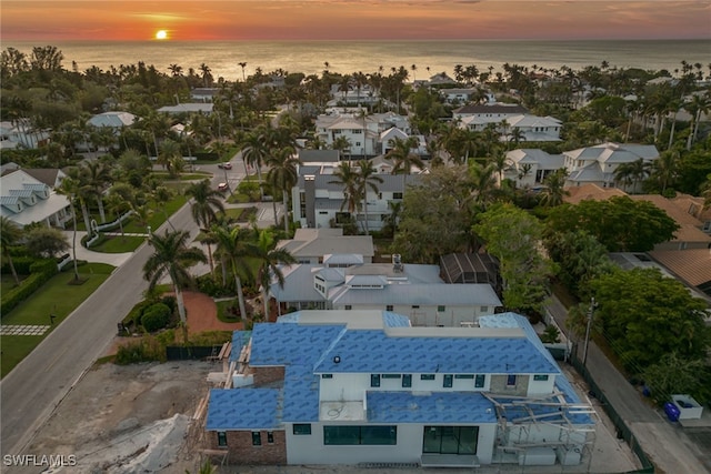 aerial view at dusk with a water view