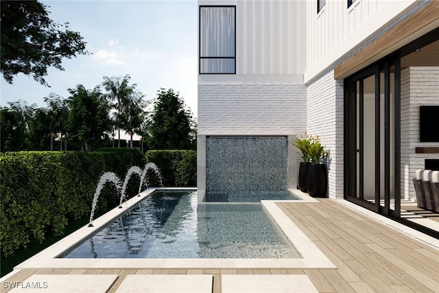 view of pool featuring pool water feature