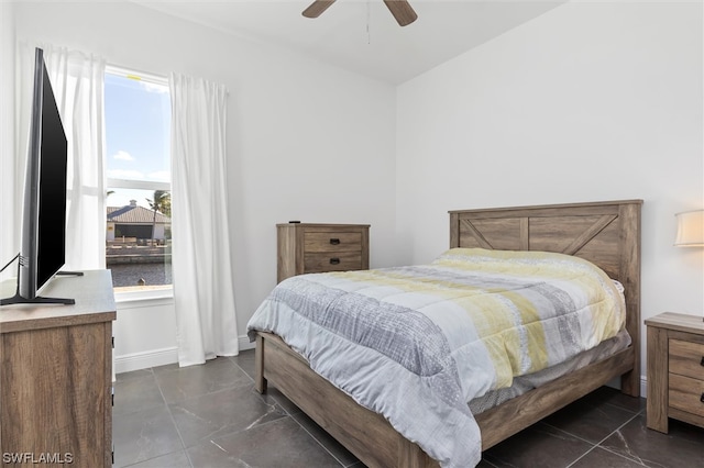 tiled bedroom with ceiling fan