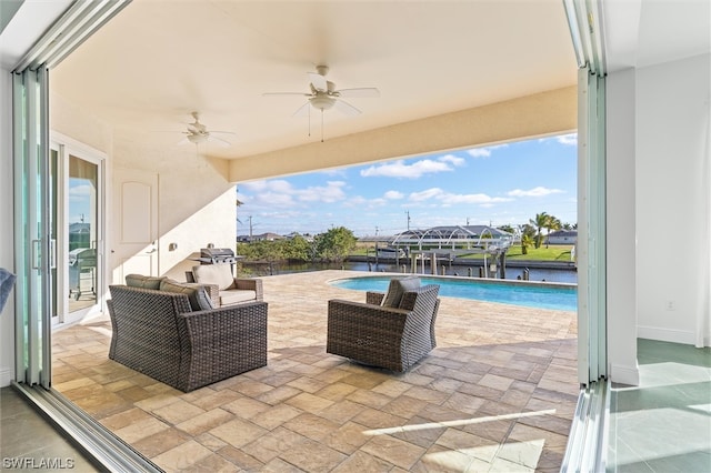 view of patio / terrace with ceiling fan and an outdoor hangout area