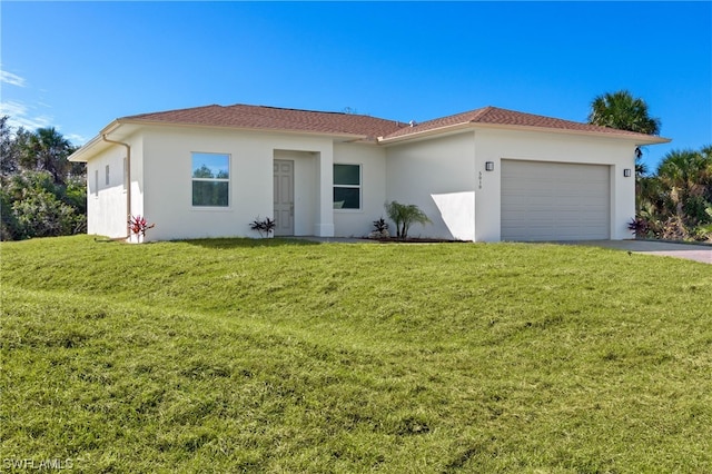 view of front facade featuring a front lawn and a garage