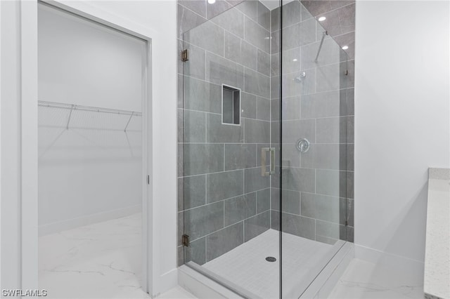 bathroom with tile patterned flooring and walk in shower