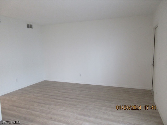 unfurnished room featuring light wood-type flooring