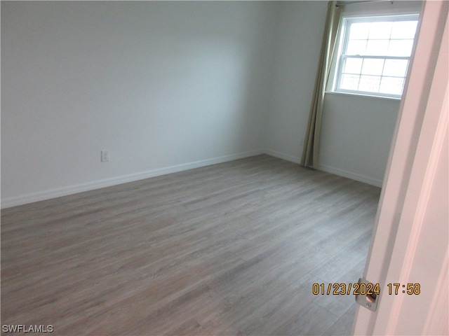 spare room featuring light hardwood / wood-style flooring