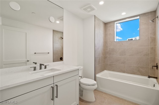 bathroom featuring shower / tub combination, toilet, visible vents, vanity, and tile patterned floors