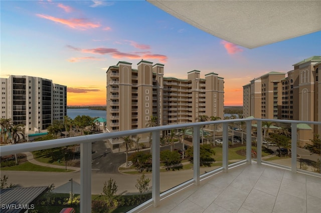 balcony featuring a water view