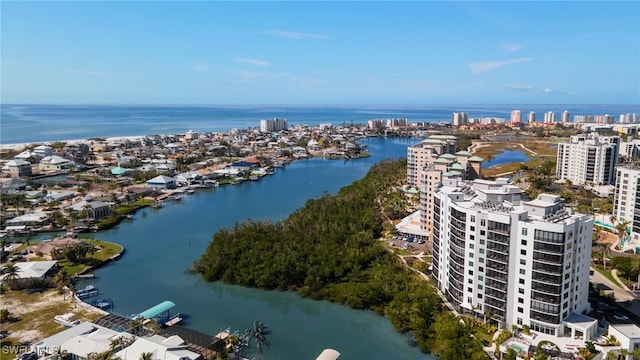 birds eye view of property with a view of city and a water view