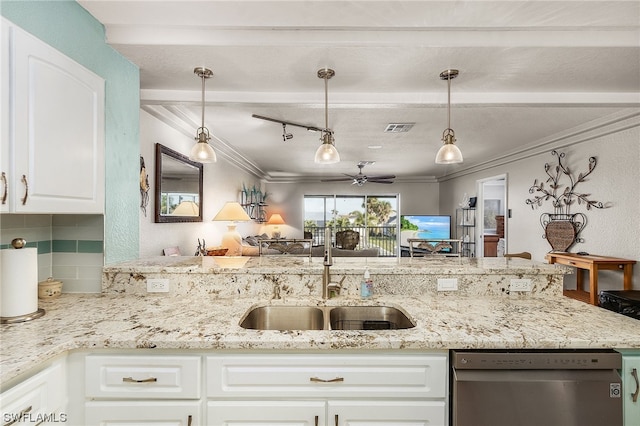 kitchen with ceiling fan, pendant lighting, white cabinets, stainless steel dishwasher, and track lighting