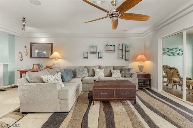 carpeted living room featuring ceiling fan and ornamental molding