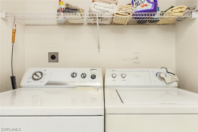 clothes washing area featuring washer and dryer and electric dryer hookup