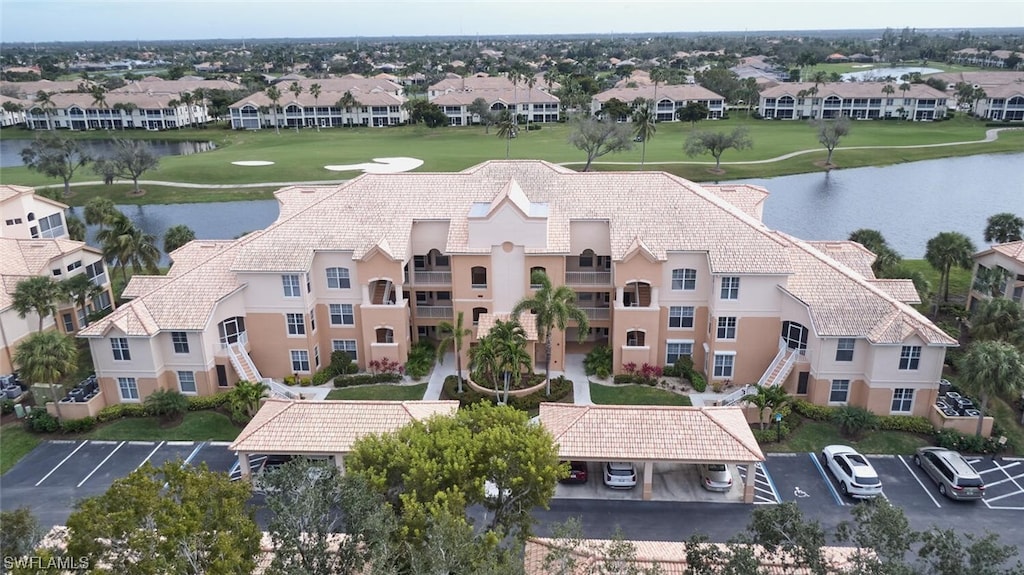 drone / aerial view with a water view