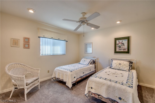 bedroom with dark carpet and ceiling fan