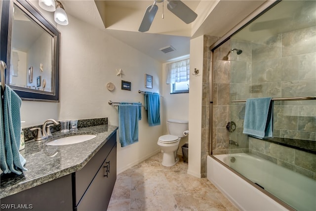 full bathroom with toilet, shower / bath combination with glass door, ceiling fan, vanity, and tile floors