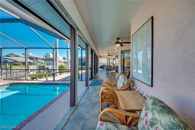 view of swimming pool featuring ceiling fan