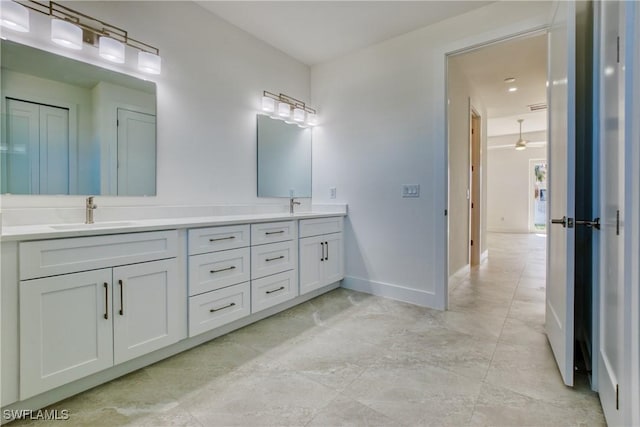 bathroom featuring ceiling fan and vanity