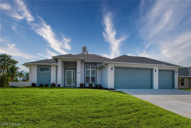 view of front facade featuring a front lawn and a garage