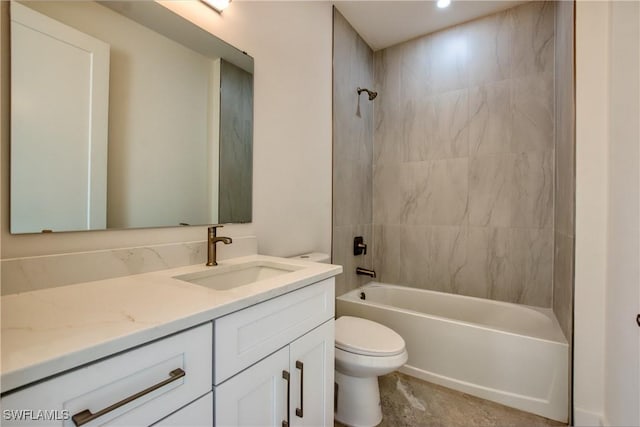 full bathroom featuring toilet, vanity, and tiled shower / bath