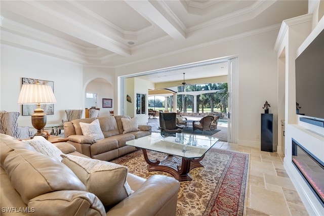 living room with beamed ceiling and ornamental molding