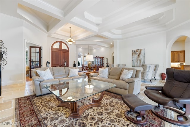 living room featuring a high ceiling, coffered ceiling, ornamental molding, beamed ceiling, and a chandelier