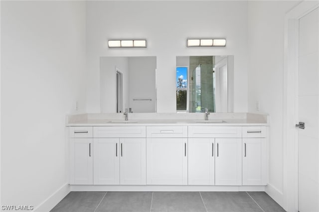 bathroom featuring tile patterned flooring, vanity, and a shower with shower door