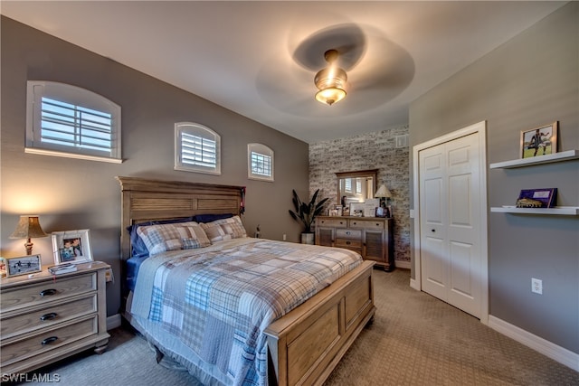 bedroom featuring carpet floors, a closet, and ceiling fan