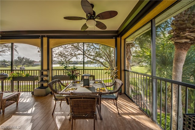 sunroom featuring ceiling fan