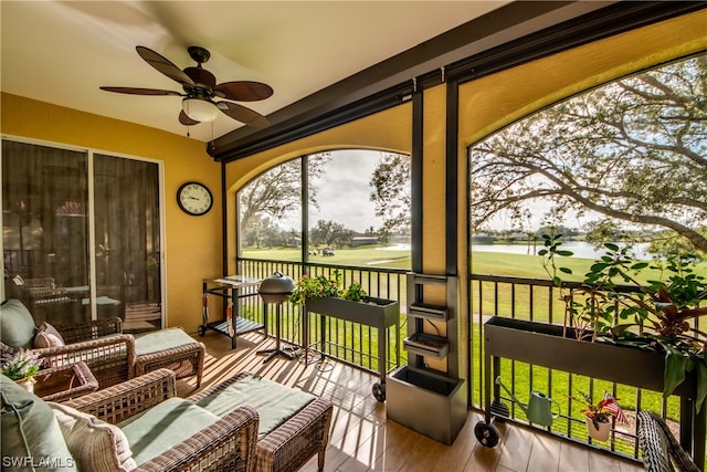 sunroom / solarium with ceiling fan